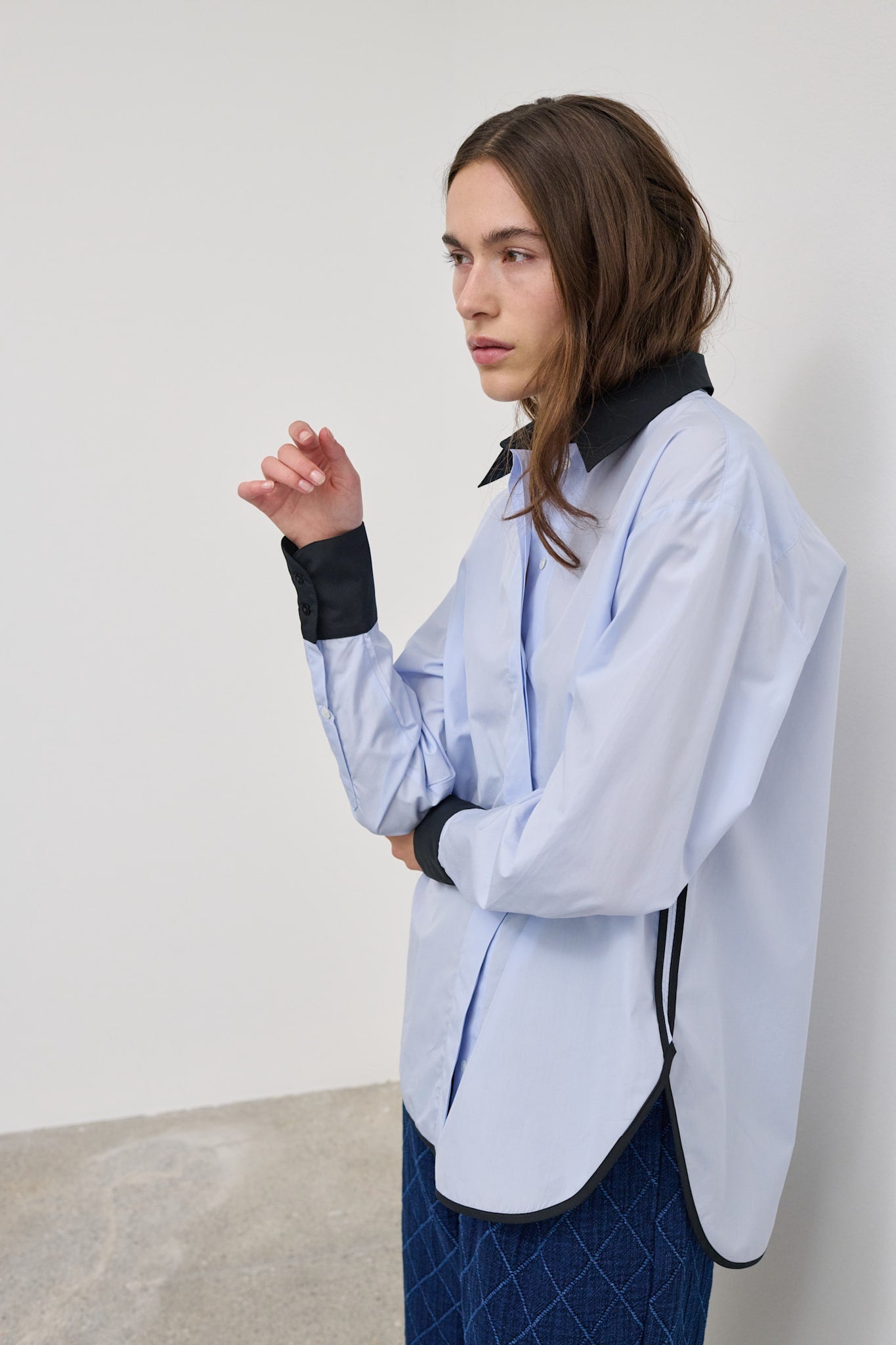 Model wearing the Vega contrast collar shirt, showcasing the oversized fit and contrasting details.