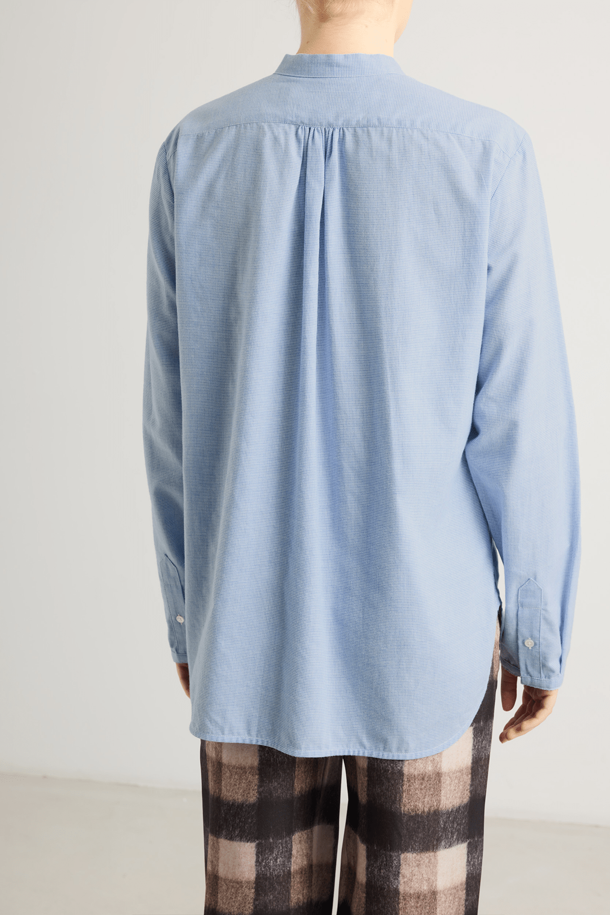 Blue Bea shirt with relaxed, straight-cut silhouette and raw-edge details.