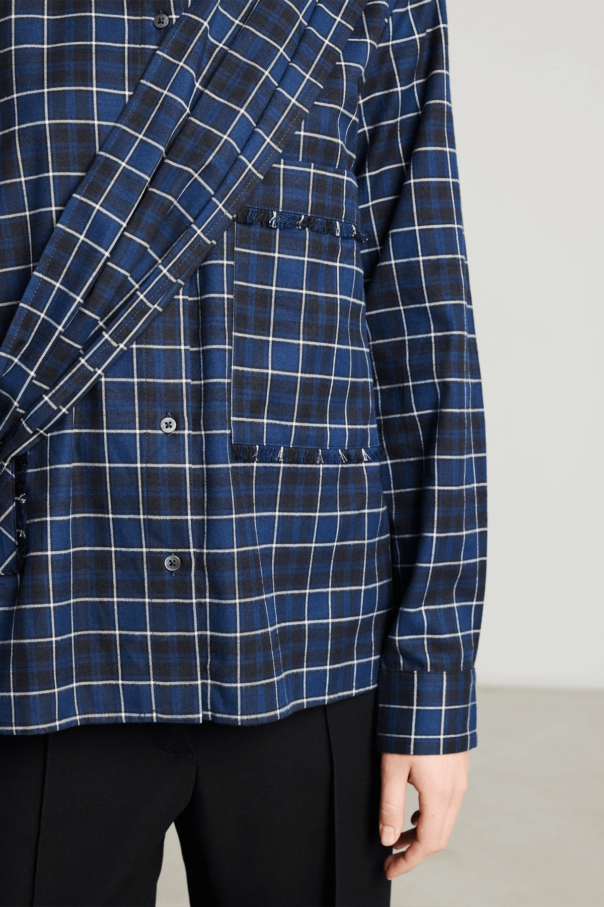 Model wearing Bene dark blue check cotton shirt with asymmetrical sash.