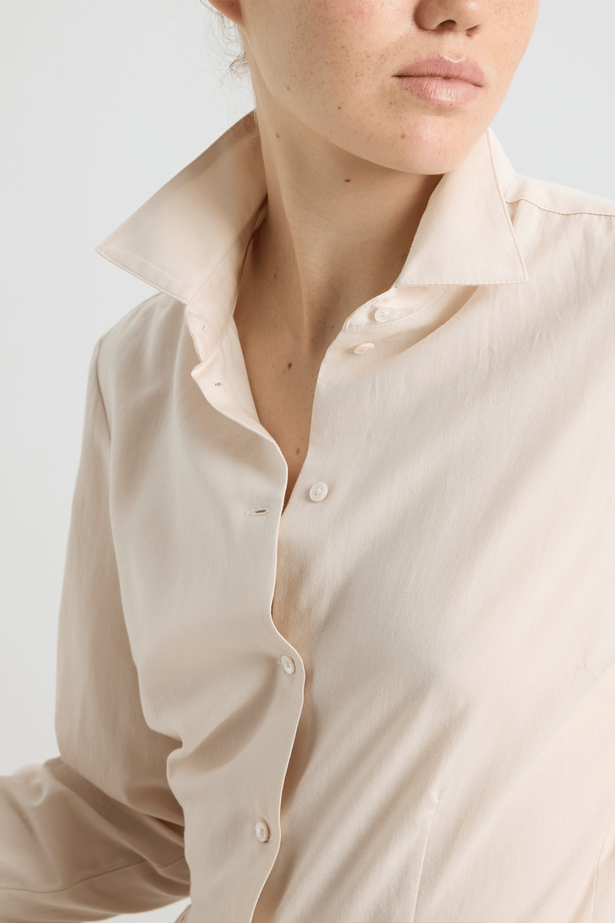 Model wearing Calista cotton shirt dress with gathered waist.