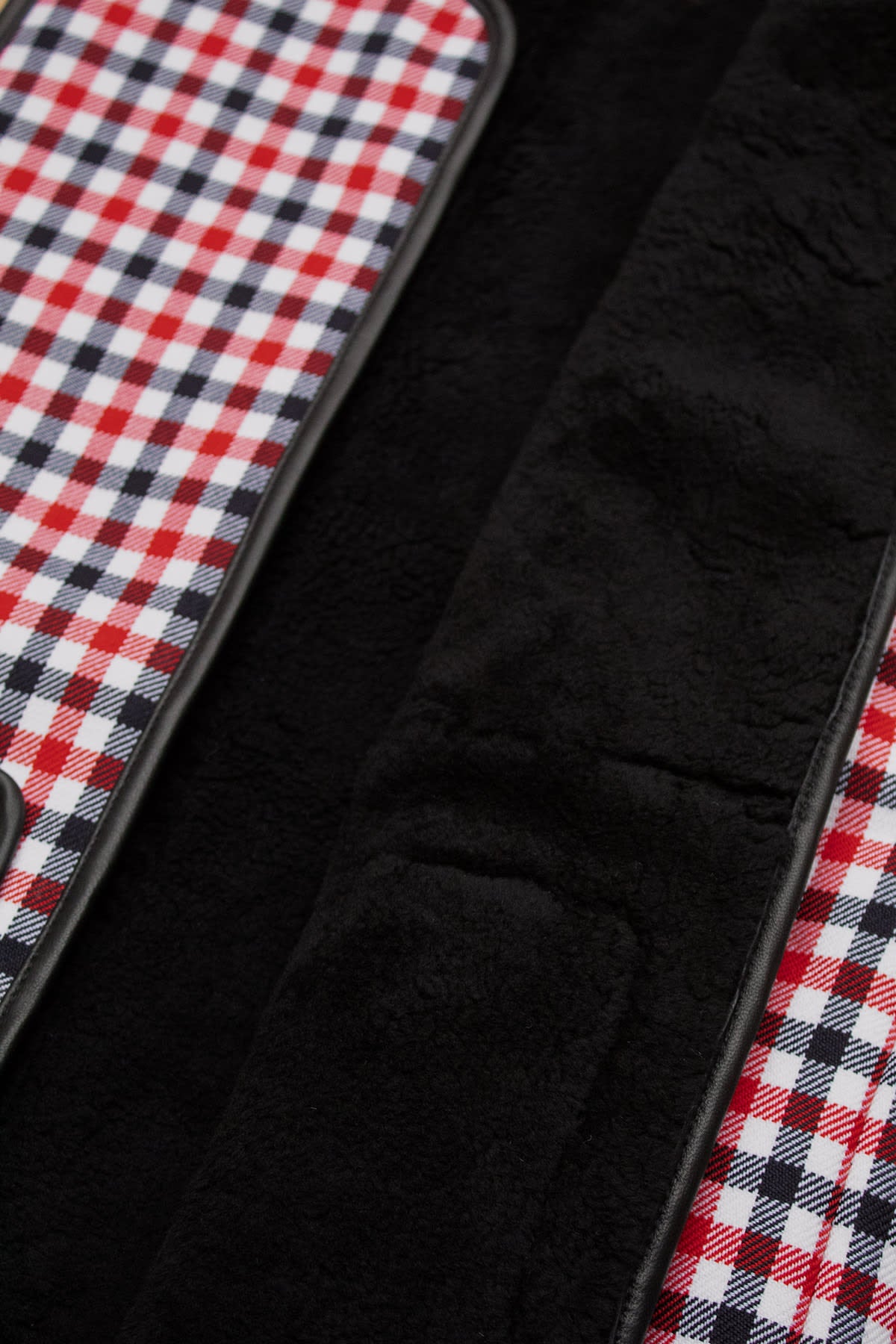 Tabitha wool vest in red and black check pattern with shearling lining and deep pockets.