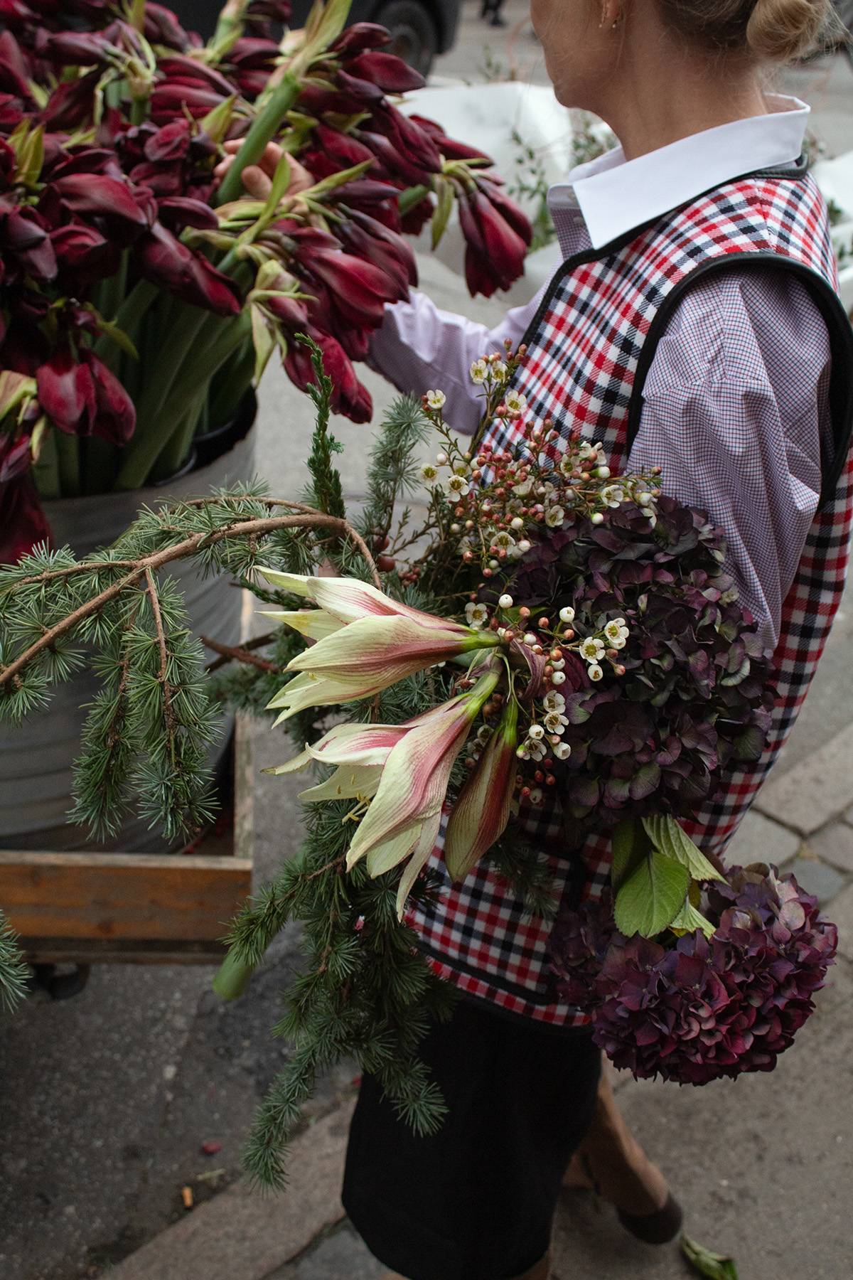Tabitha wool vest in red and black check pattern with shearling lining and deep pockets.