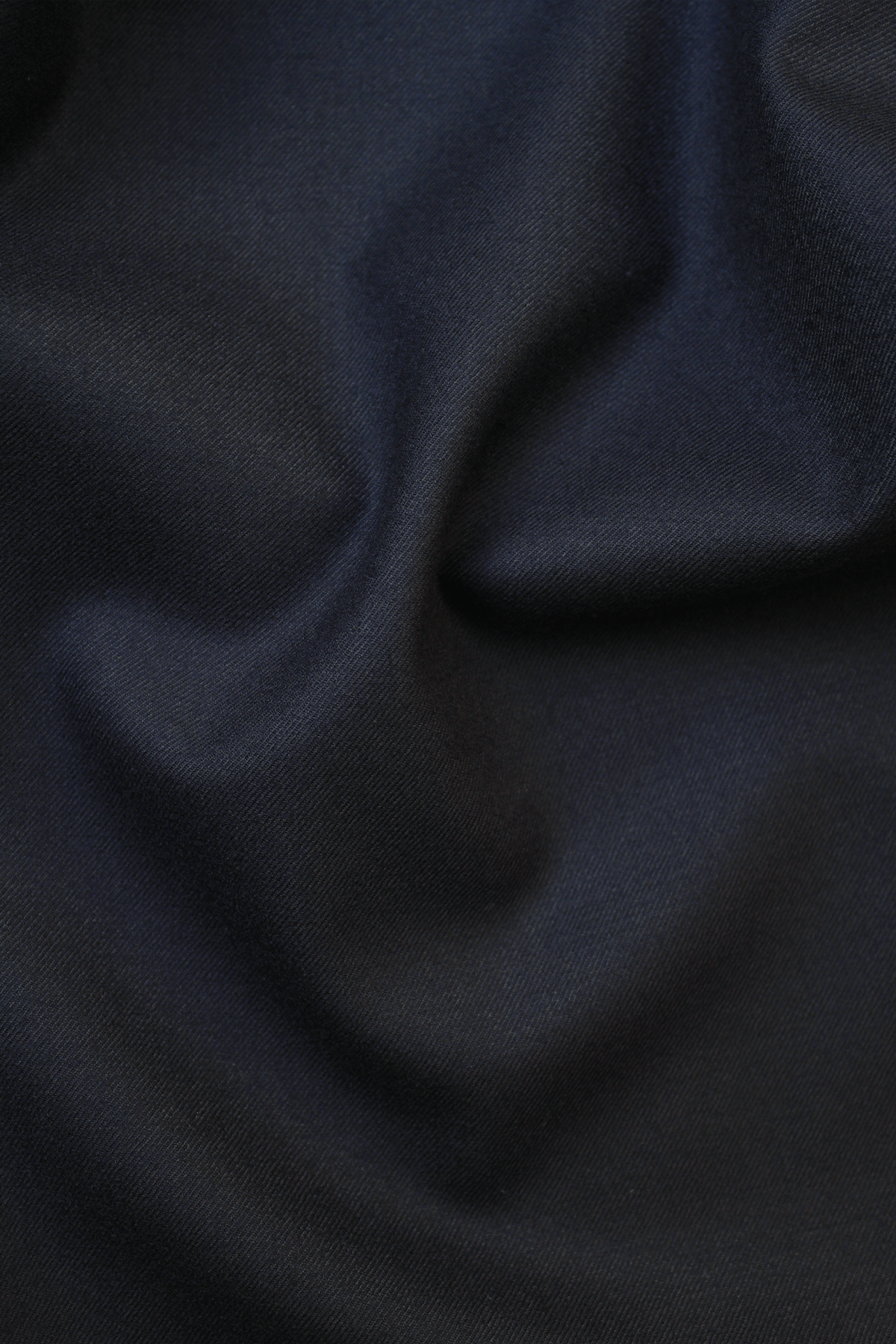 Close-up of dark blue Tinnie vest in cashmere–virgin wool.