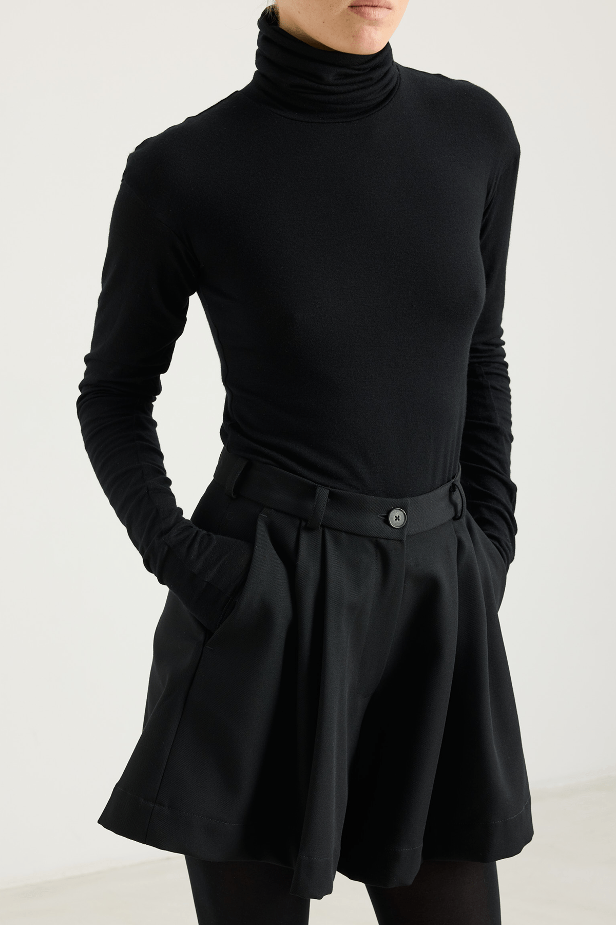 girl in black jersey turtleneck