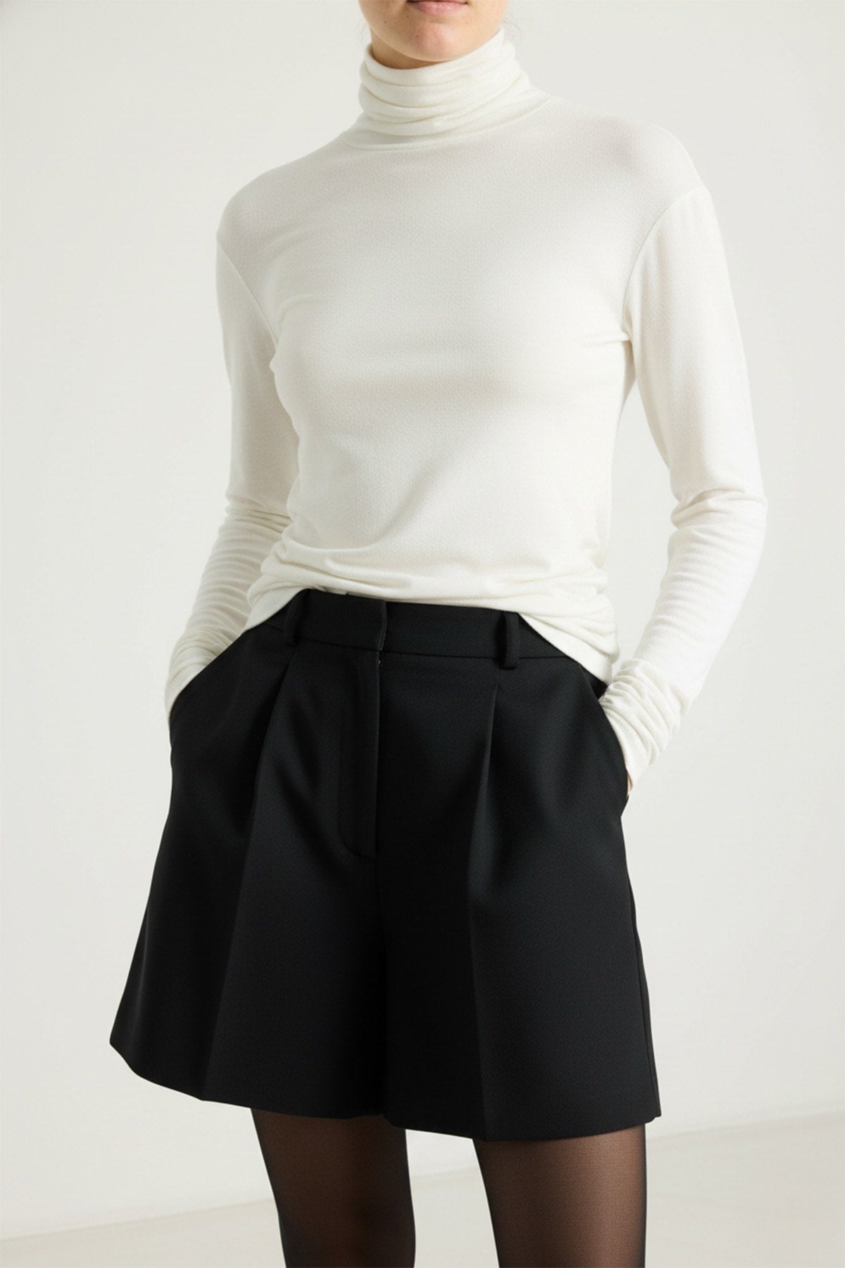 girl in a white jersey cashmere turtleneck