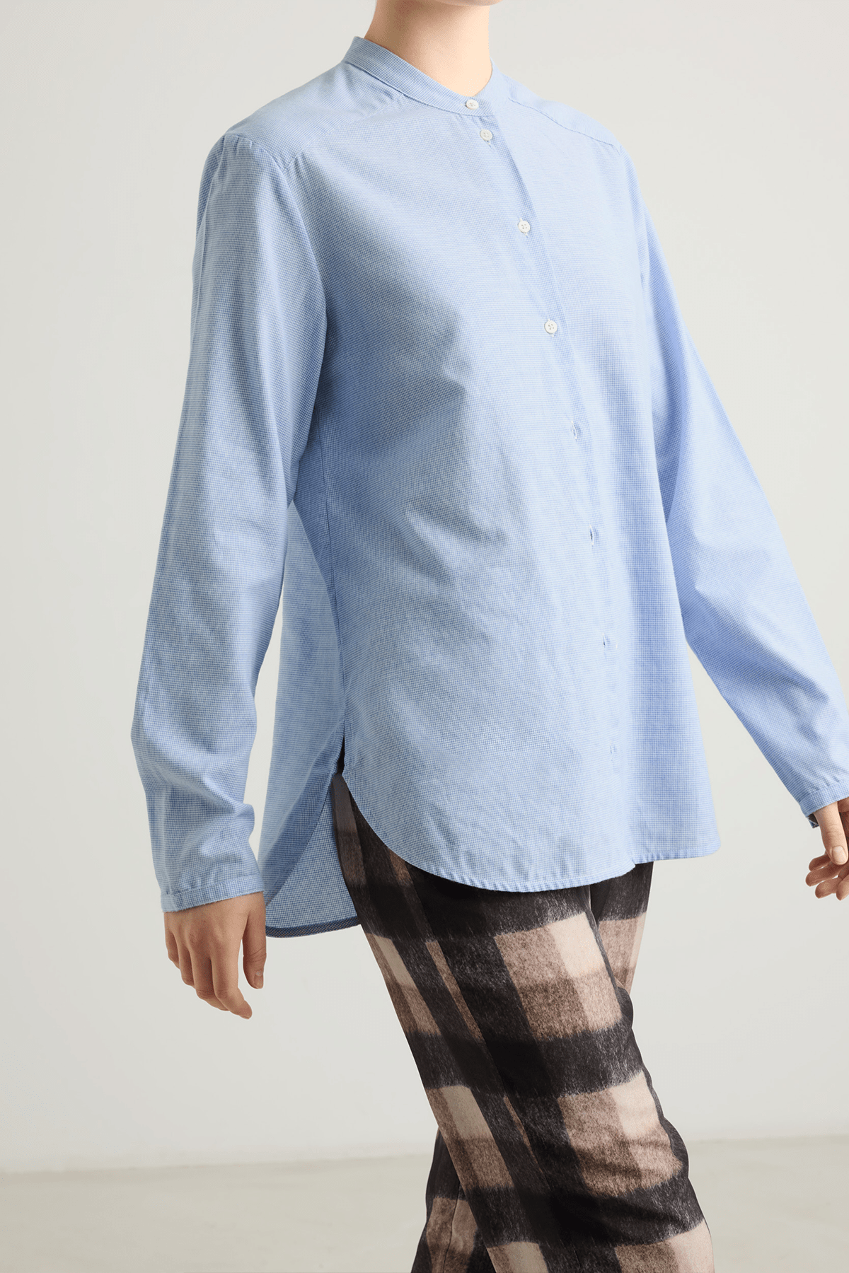 girl in blue houndstooth button down shirt