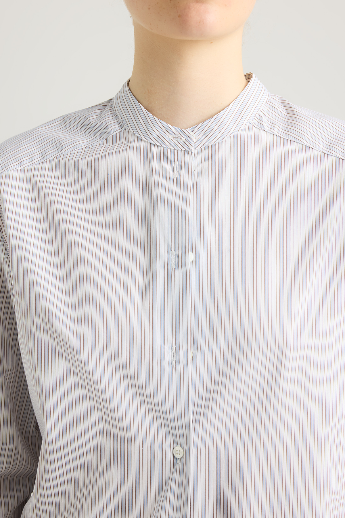 girl in striped white and blue shirt