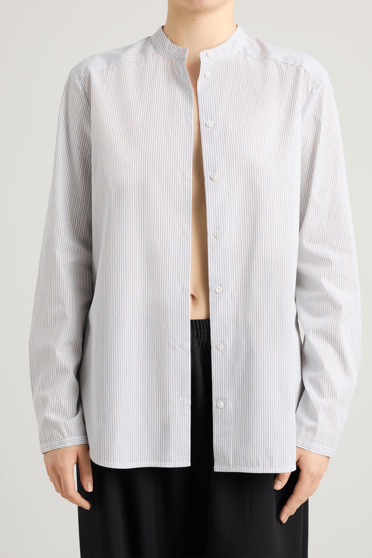 girl in striped white and blue shirt