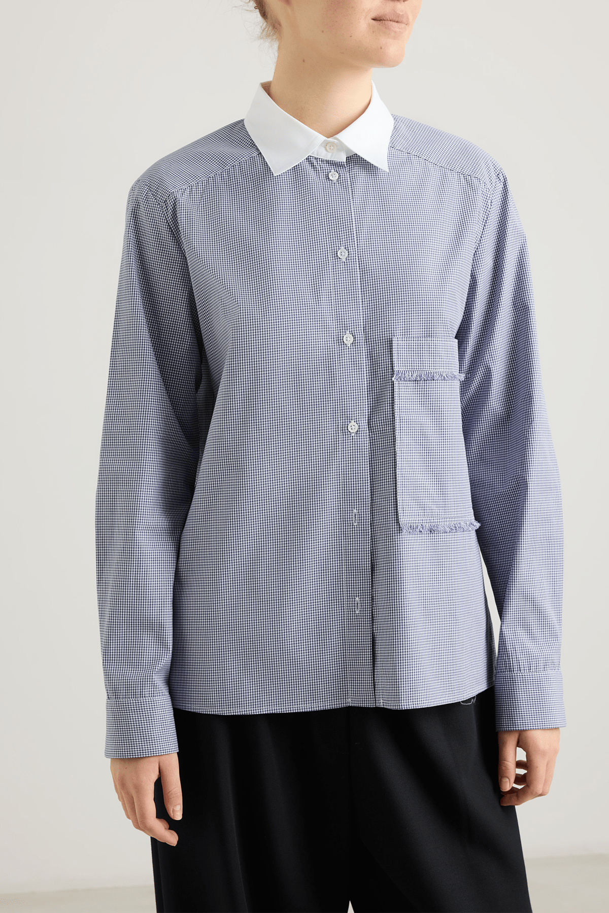 girl in blue check shirt with contrat collar