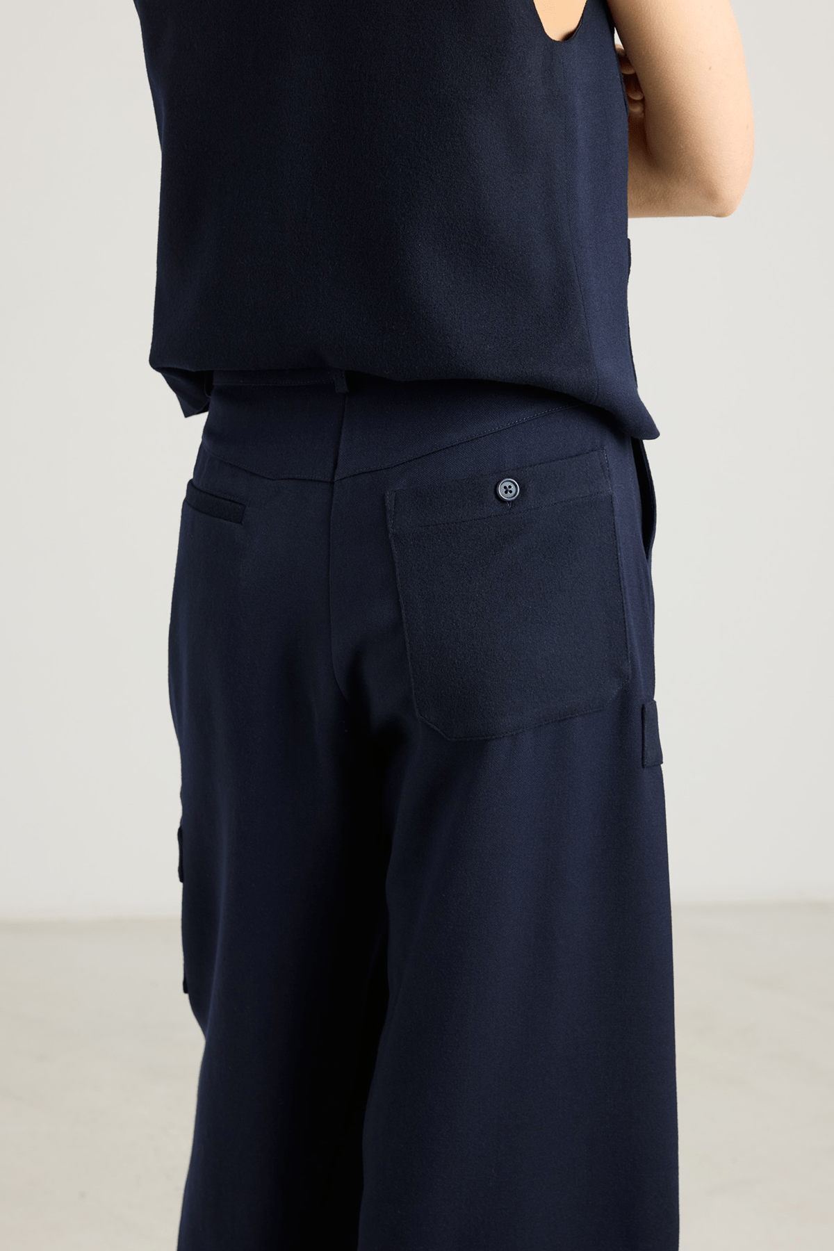 girl in Navy straigt leg trousers