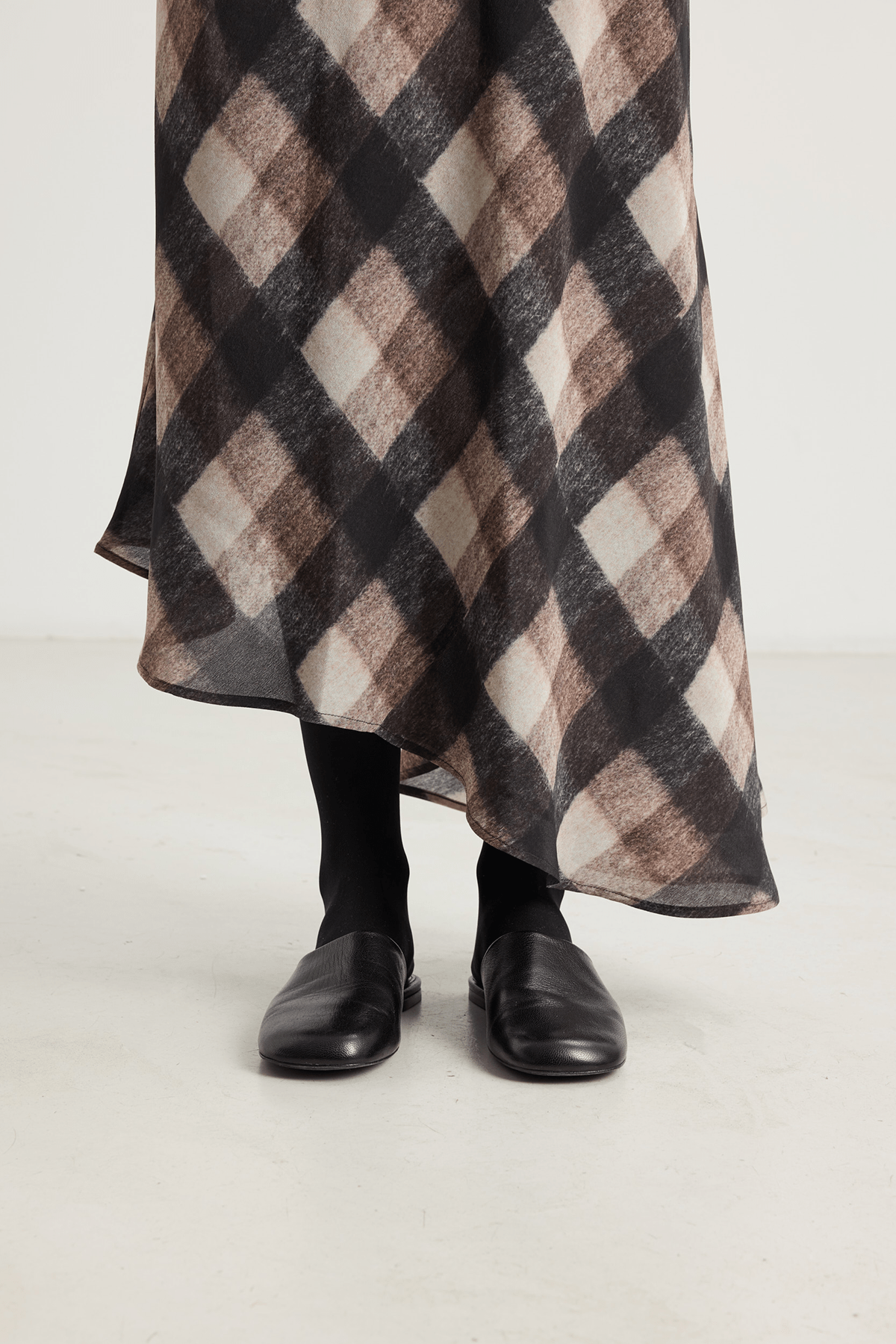 brown check skirt and black shoes