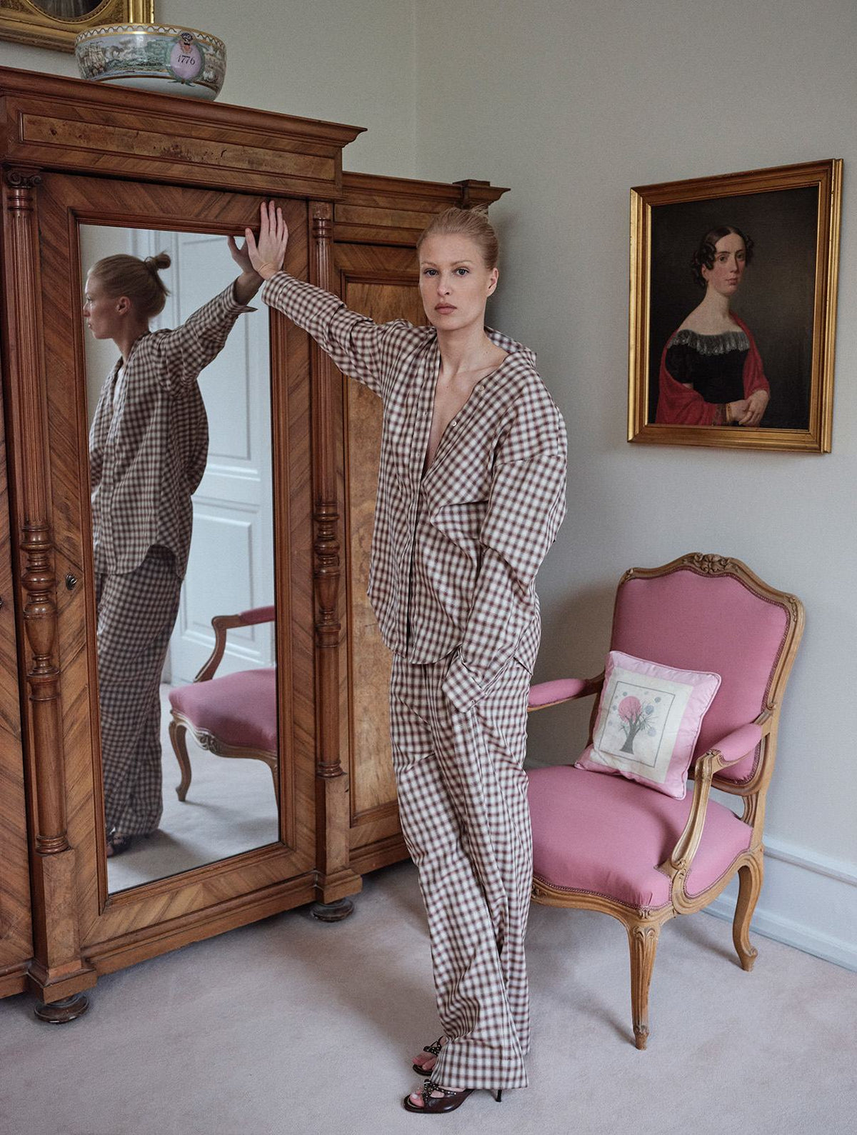 blonde girl in Brown check set reflected in a mirror