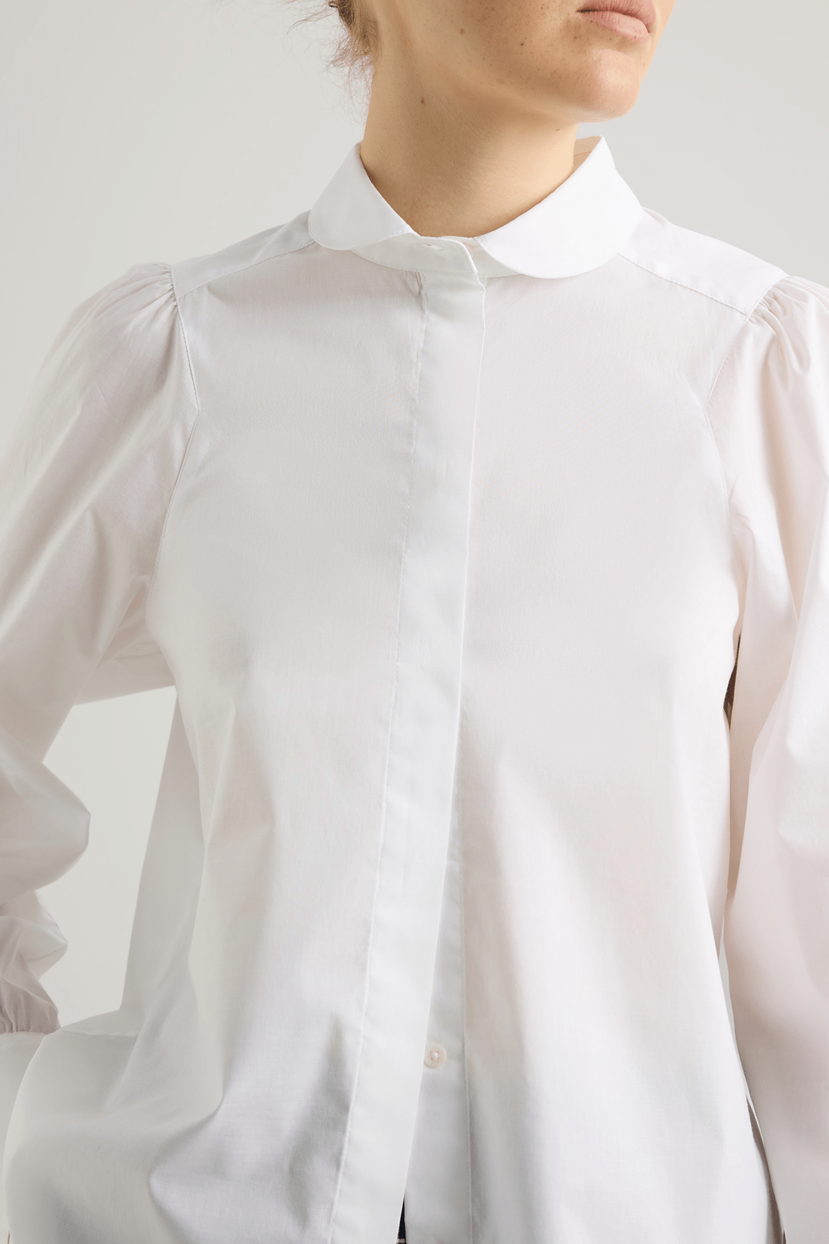 girl in white cotton button down shirt