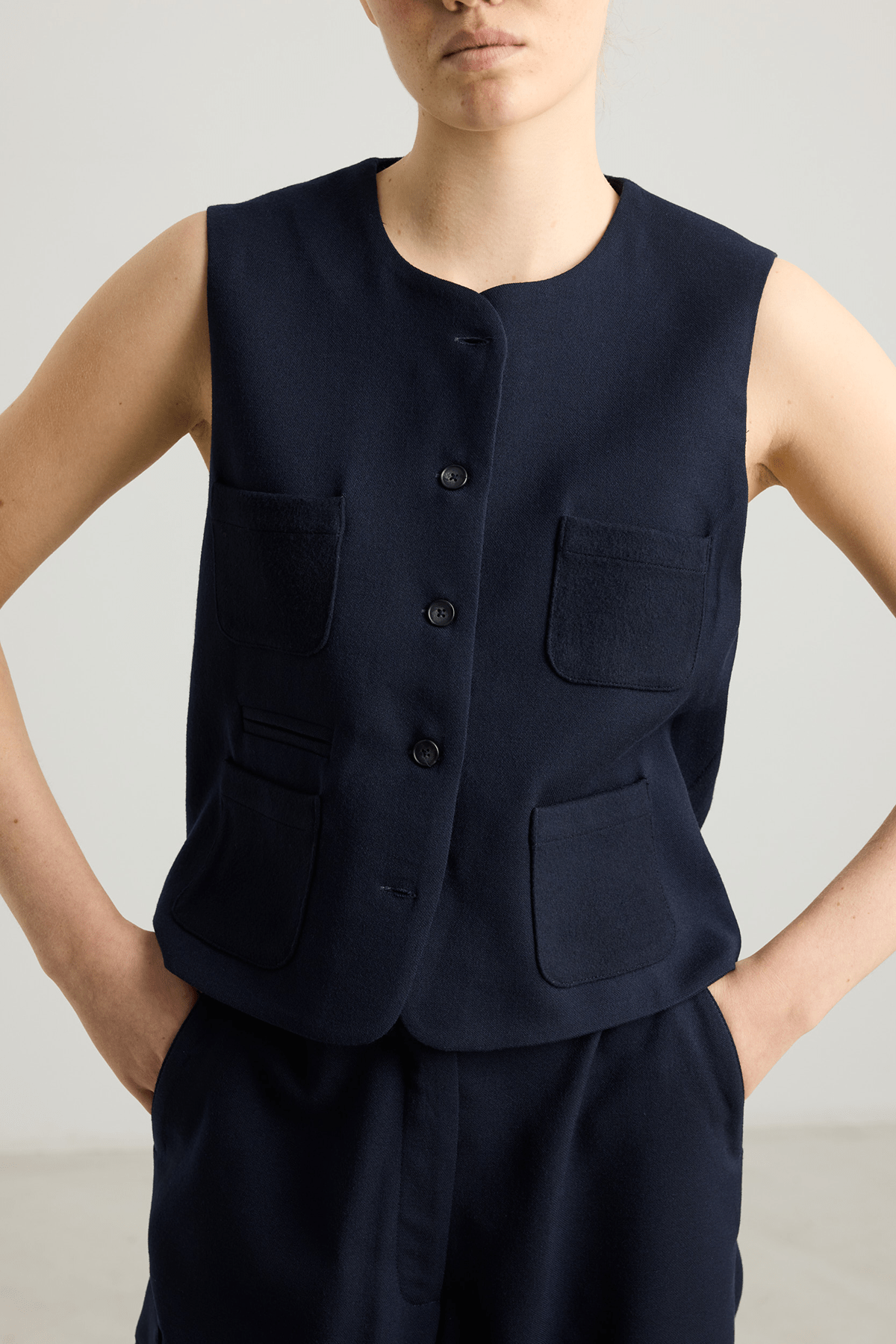 navy vest with four pockets