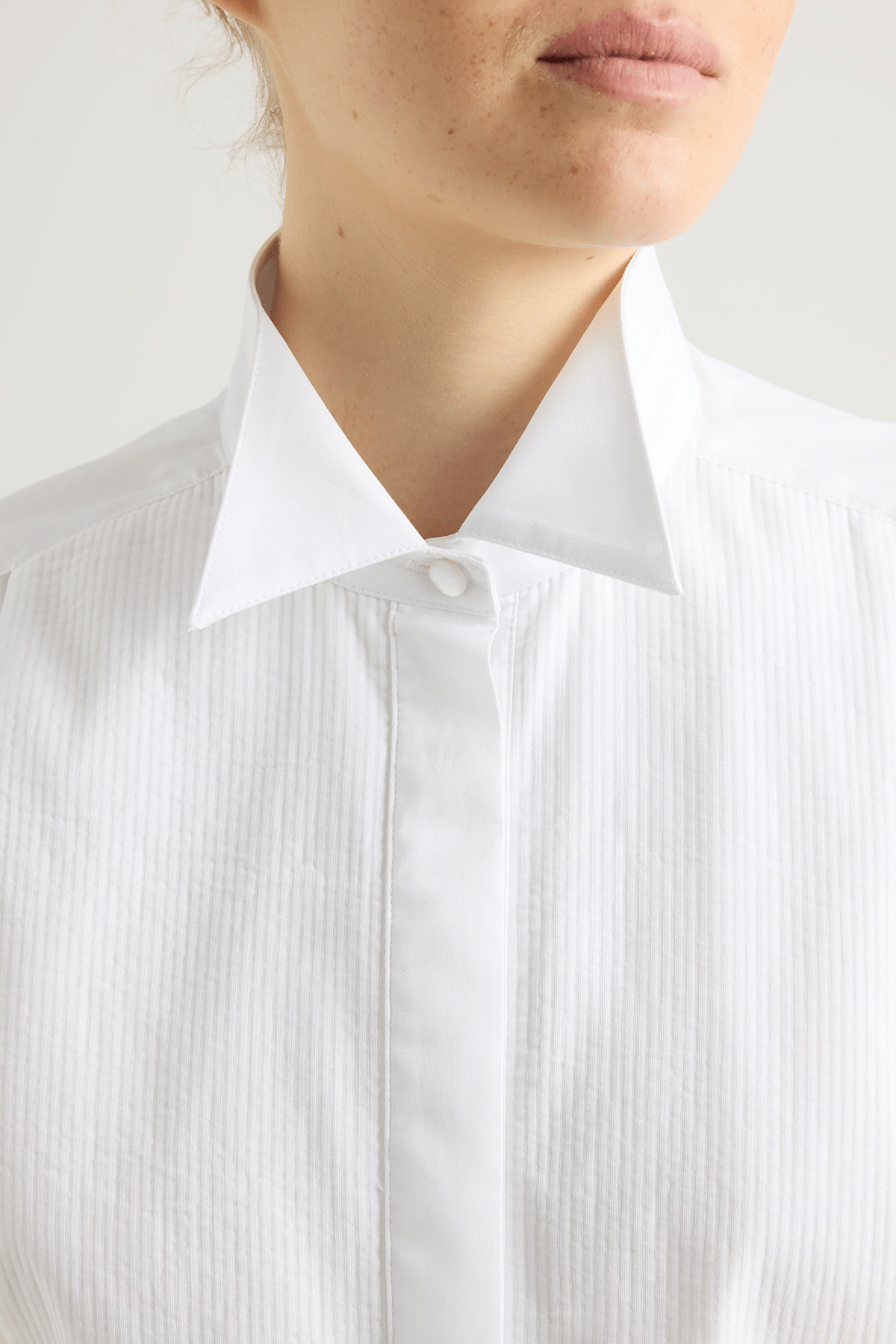 girl in white tuxedo shirt