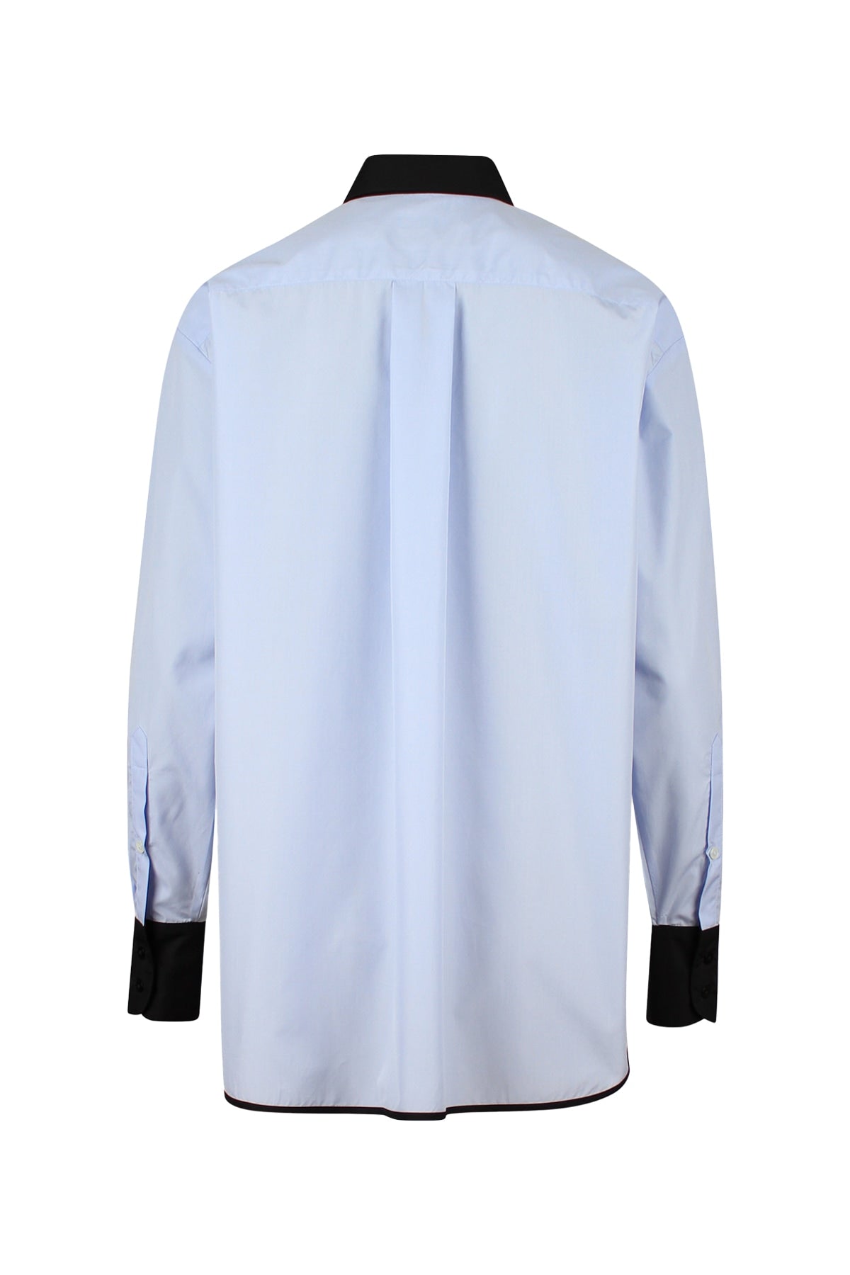 Back view of the Vega contrast collar shirt, highlighting the structured pleat and contrast bias binding.