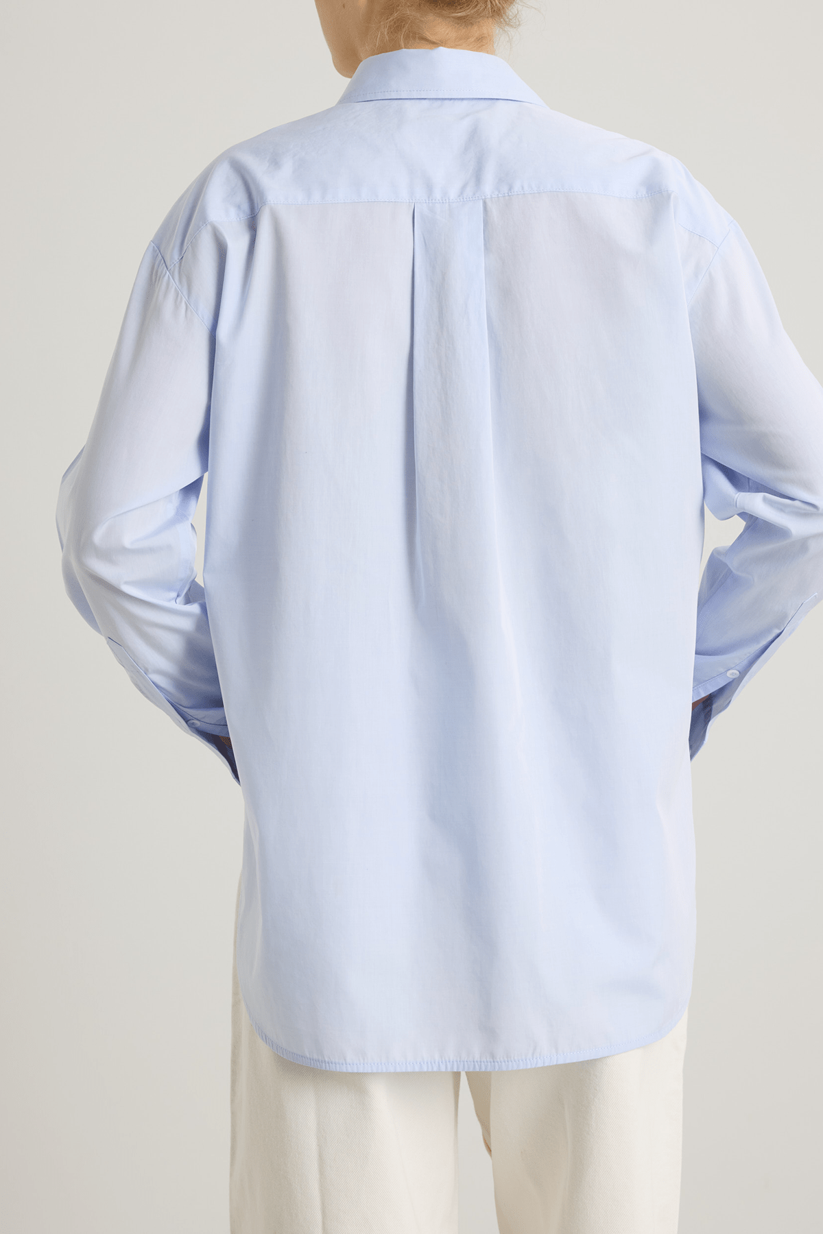 girl in blue cotton button down shirt