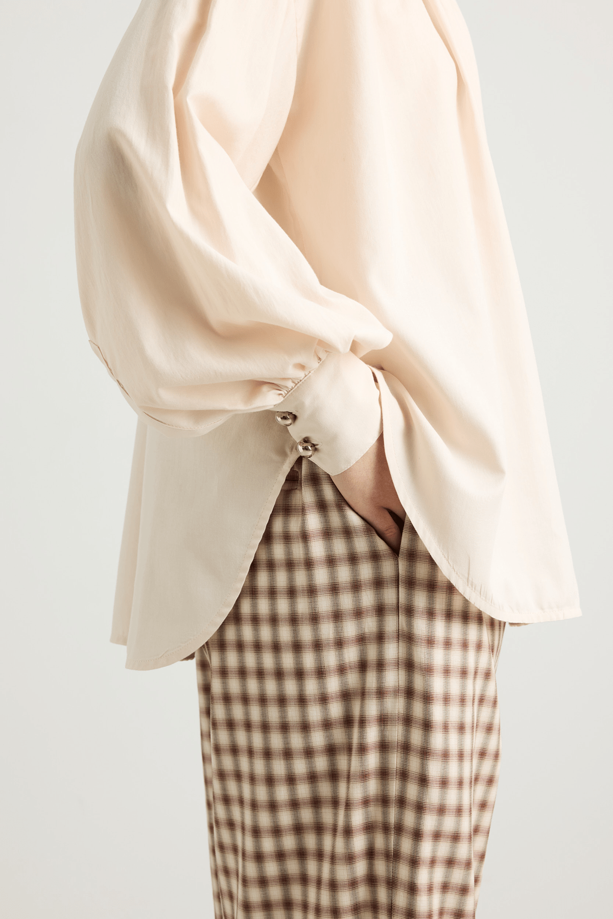Cream blouse with a front button closure, and long voluminous balloon sleeves